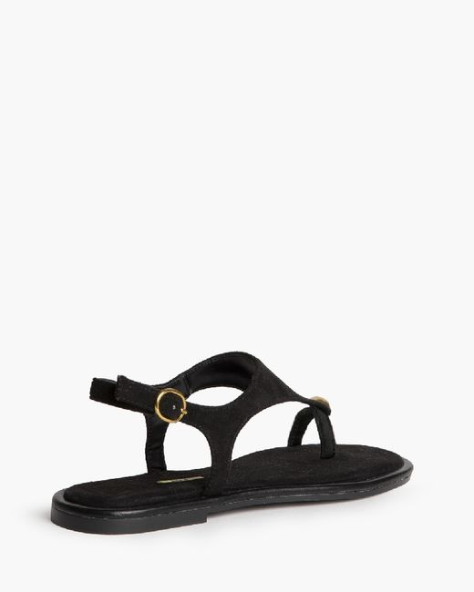 Sandalias negras planas con anillo metálico