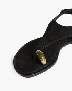Sandalias negras planas con anillo metálico