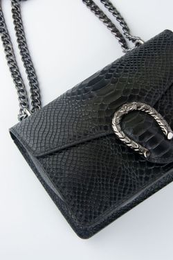 Sac en cuir de crocodile avec fer à cheval noir
